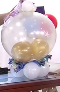como hacer una piñata de globos 11